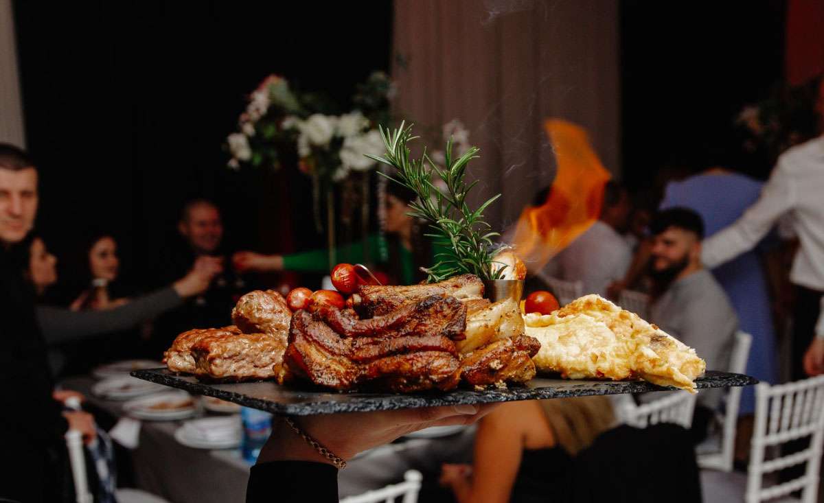 Corporate BBQ Catering Cost in Atlanta event with grilled meats served at a corporate dinner gathering