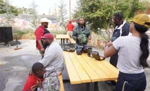 Guests enjoying a BBQ Pop-Up Event in Atlanta at an outdoor dining area.